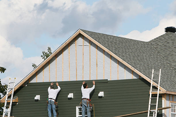 Professional Storm Damage Siding Repair technician working in Strongstown, PA